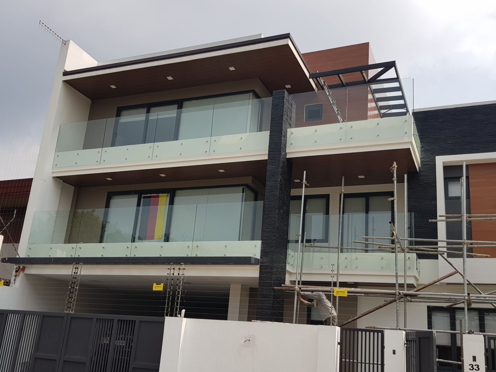 Modern residence with glass balcony railings