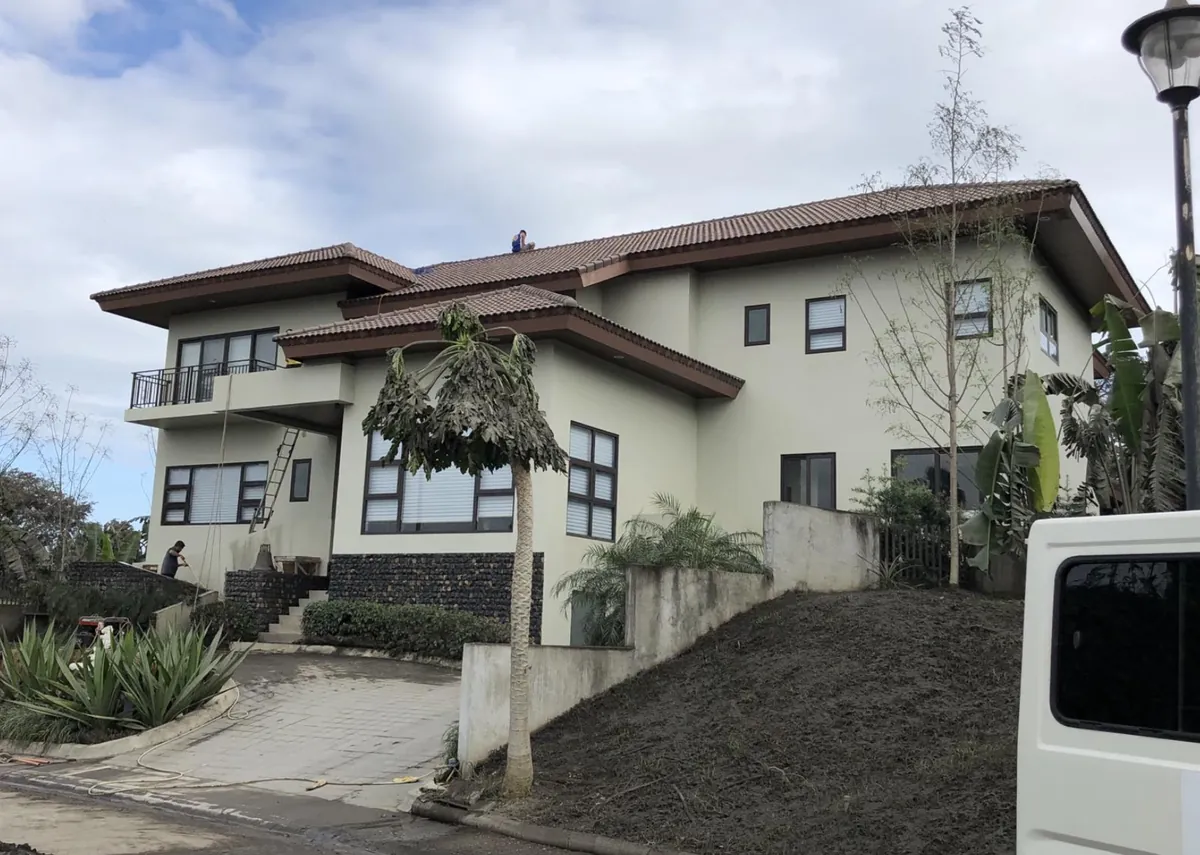 Two-story residential house with aluminum window installation